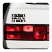 Vinilo STICKERS MAKE MY CAR GO FASTER junto al piloto trasero de un coche blanco